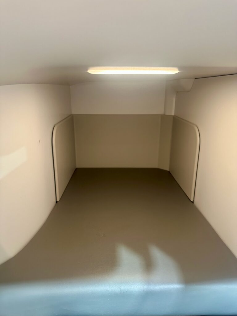 Large footwell is pictured, with a light illuminating the space.