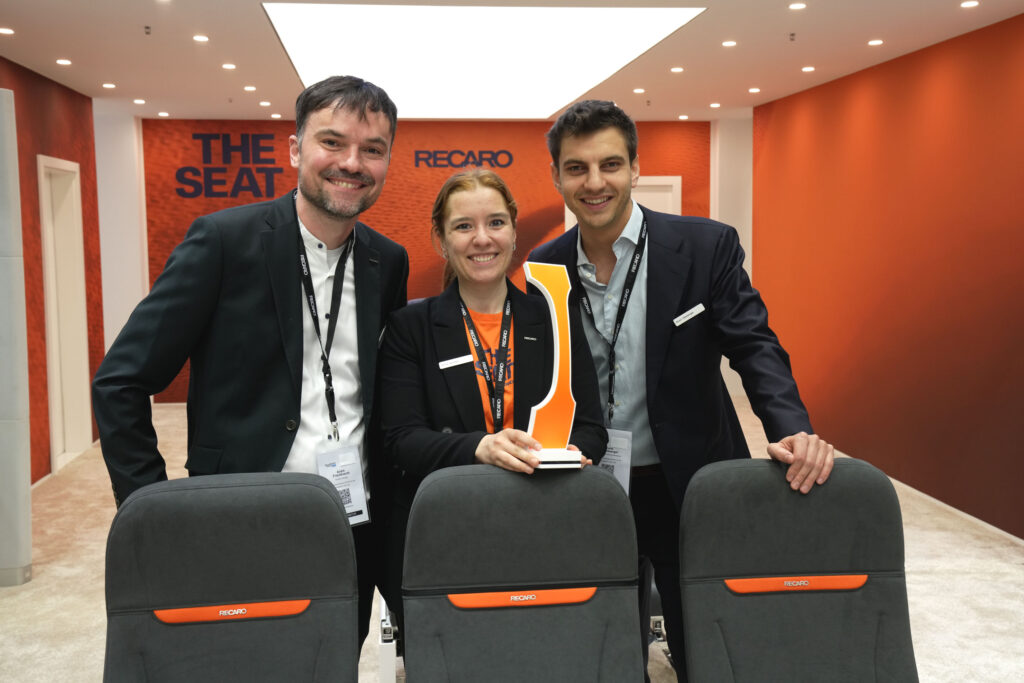 RECARO executives celebrate the Crystal Cabin Award in front of R Sphere