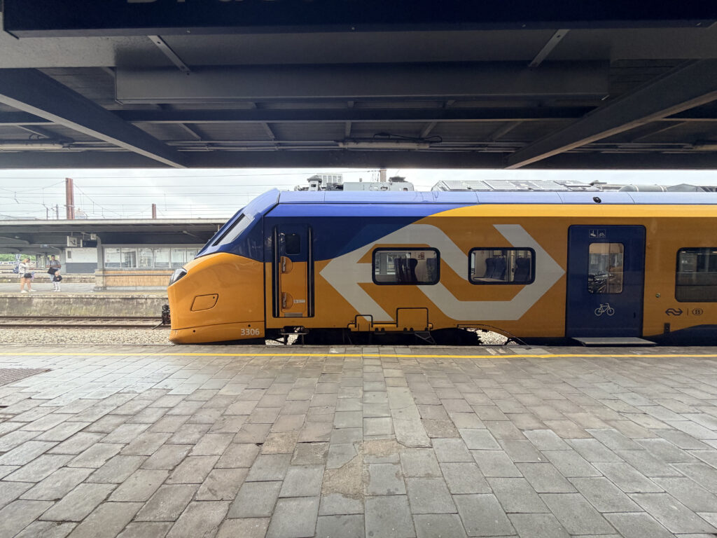 EuroCity Direct rail car arriving at the platform. 