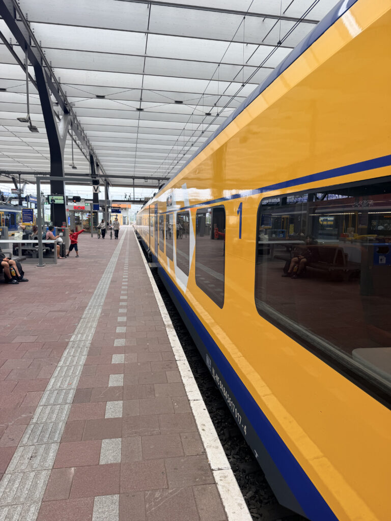 EuroCity Direct rail car arriving at the platform and ready for boarding.