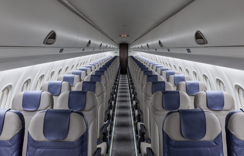 Rows of 2-2 configured economy class seats with more padding than the prior generation.