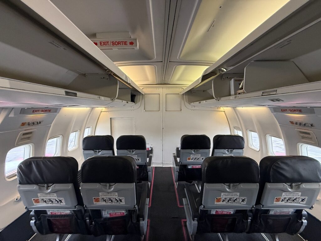A bulkhead wall separates the passenger cabin from the cargo cabin.