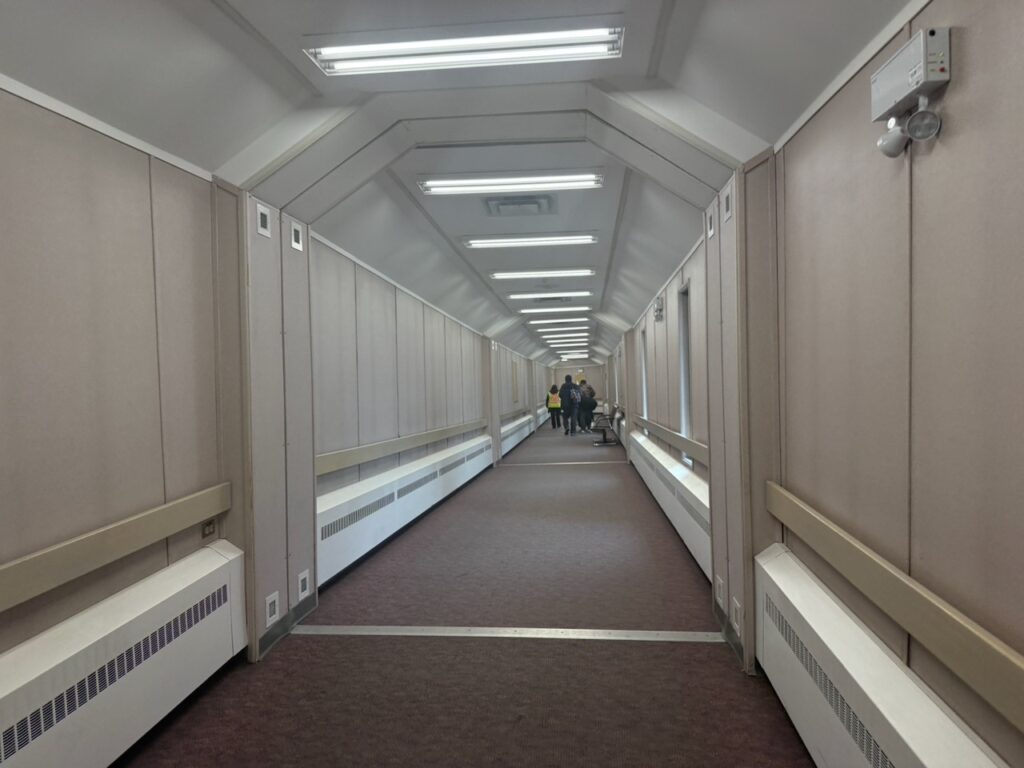 Long, enclosed walk at YEG leads to Canadian North boarding gate.