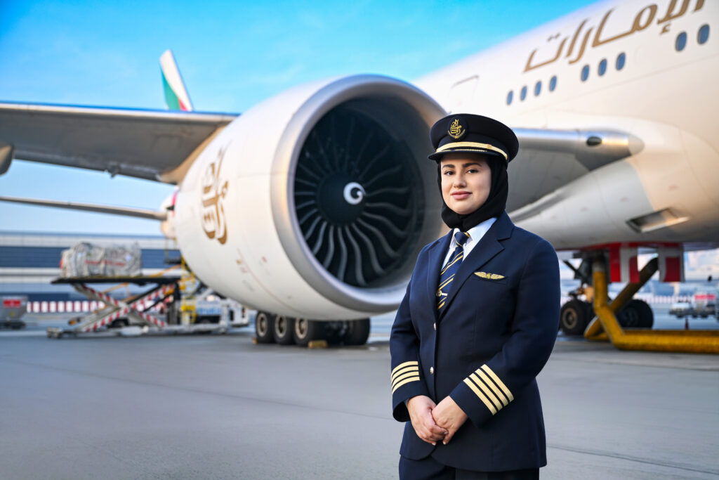 Captain Hanan Mohammed Jawad in front of an Emirates 777.