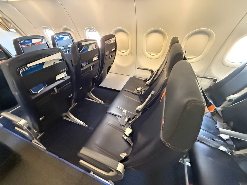 A close up of Allegiant's Acro Series 3 economy class seats, and the extra-legroom provided by Allegiant Extra