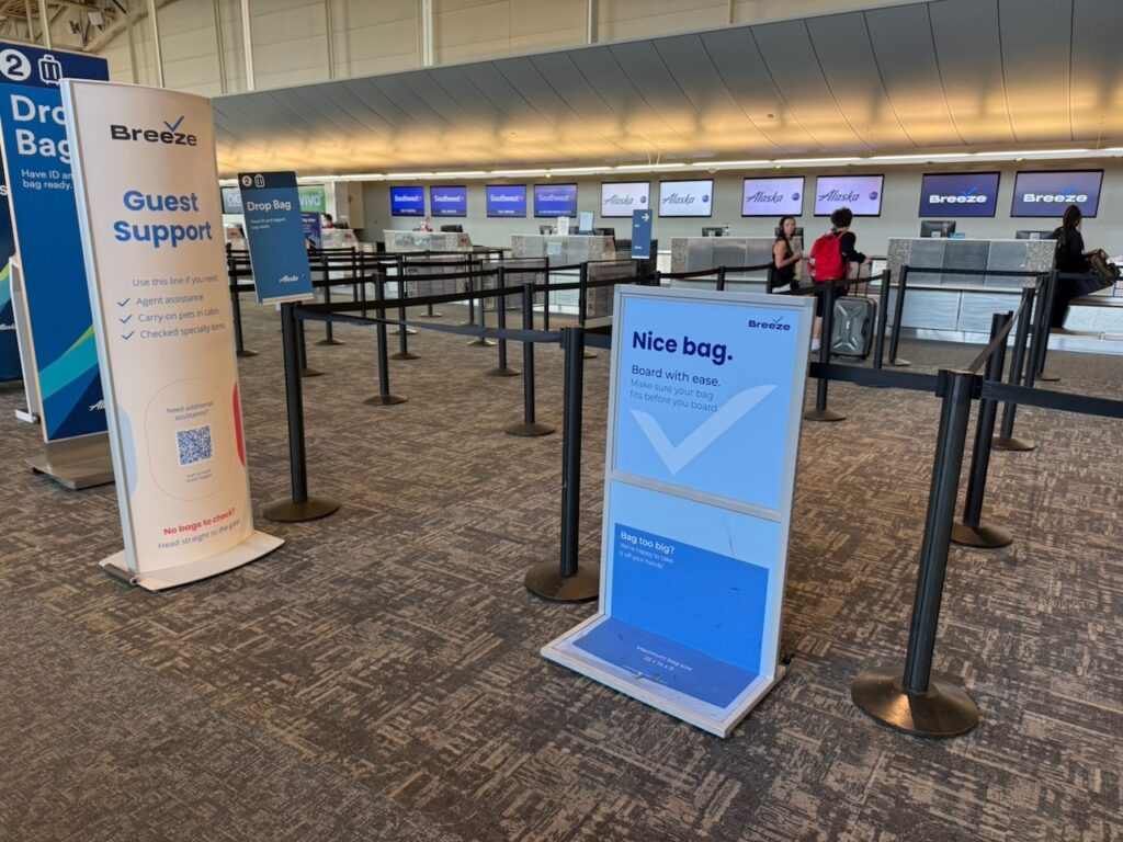 Breeze check in with signage offering Guest Support