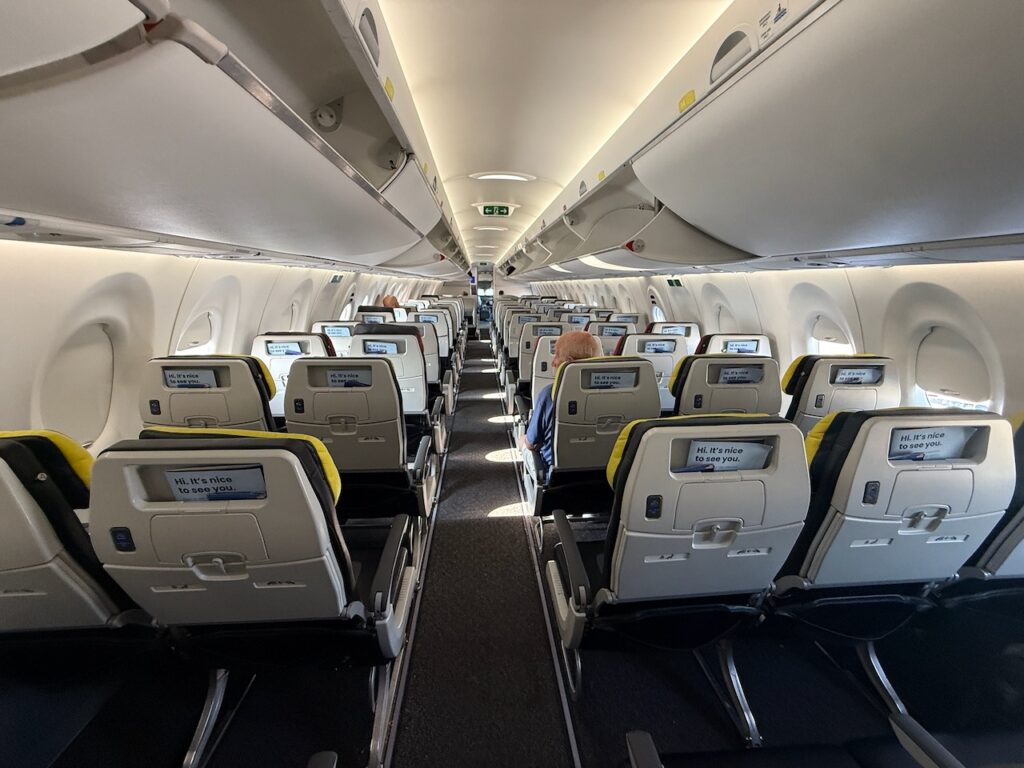 Looking down the A220 cabin from the back.