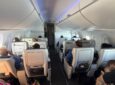 Passengers seated in Ascent recliners up front on the A220