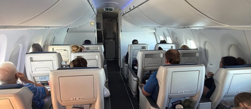 Passengers seated in Ascent recliners up front on the A220