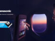 Panasonic and Eyesafe logos are placed on top of an image of a passenger using Astrova IFE.