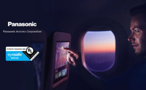 Panasonic and Eyesafe logos are placed on top of an image of a passenger using Astrova IFE.