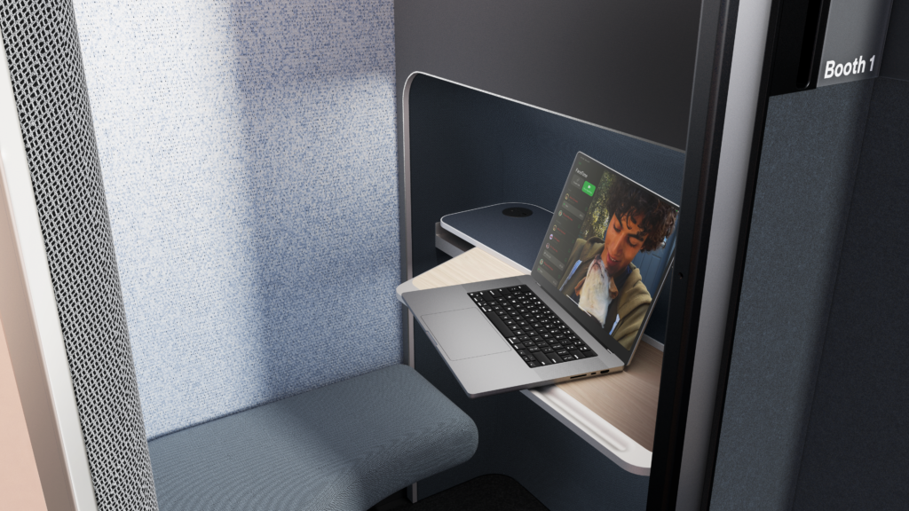 A laptop sits on a table inside the Boeing EnCore E-Lounge booth