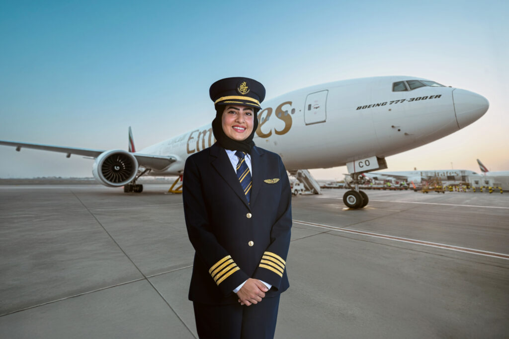 Captain Bakhita Al Mheiri in front of an Emirates 777