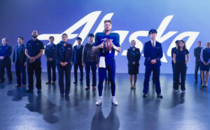 Sam Darnold with Alaska Airlines crew members