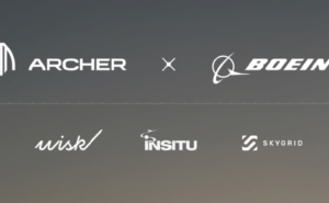Logos of all companies in the deal, seen against a grey background