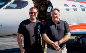 SyberJet CEO Trevor Milton (left) and pilot Gordon “Gordy” Bryan (right) in front of the record-setting SJ30-2 following the transcontinental flight.