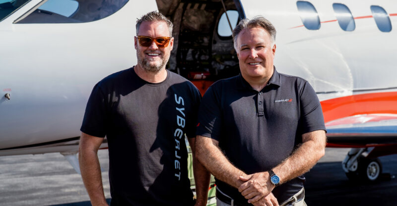 SyberJet CEO Trevor Milton (left) and pilot Gordon “Gordy” Bryan (right) in front of the record-setting SJ30-2 following the transcontinental flight.