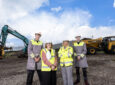 Airbus execs pose for a photo at the ground breaking in Belfast.