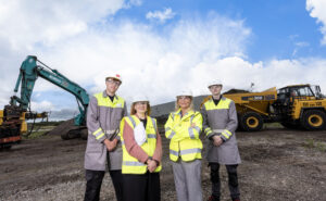 Airbus execs pose for a photo at the ground breaking in Belfast.
