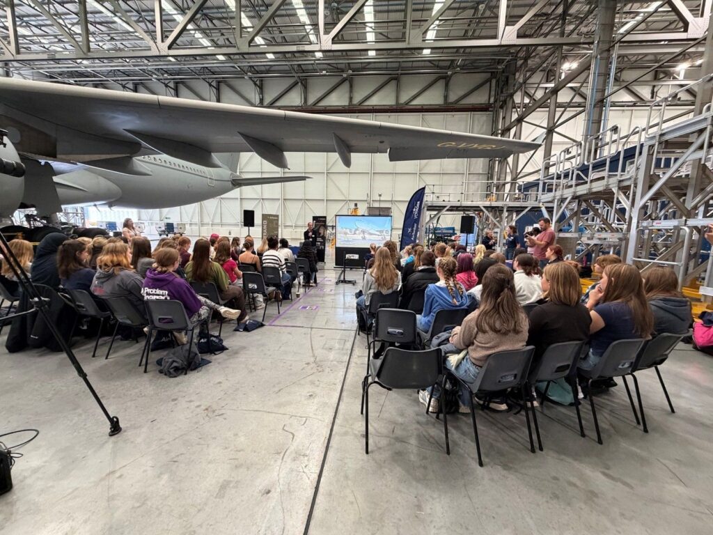 Attendees are listen to speakers at the Girls in Aviation Day.