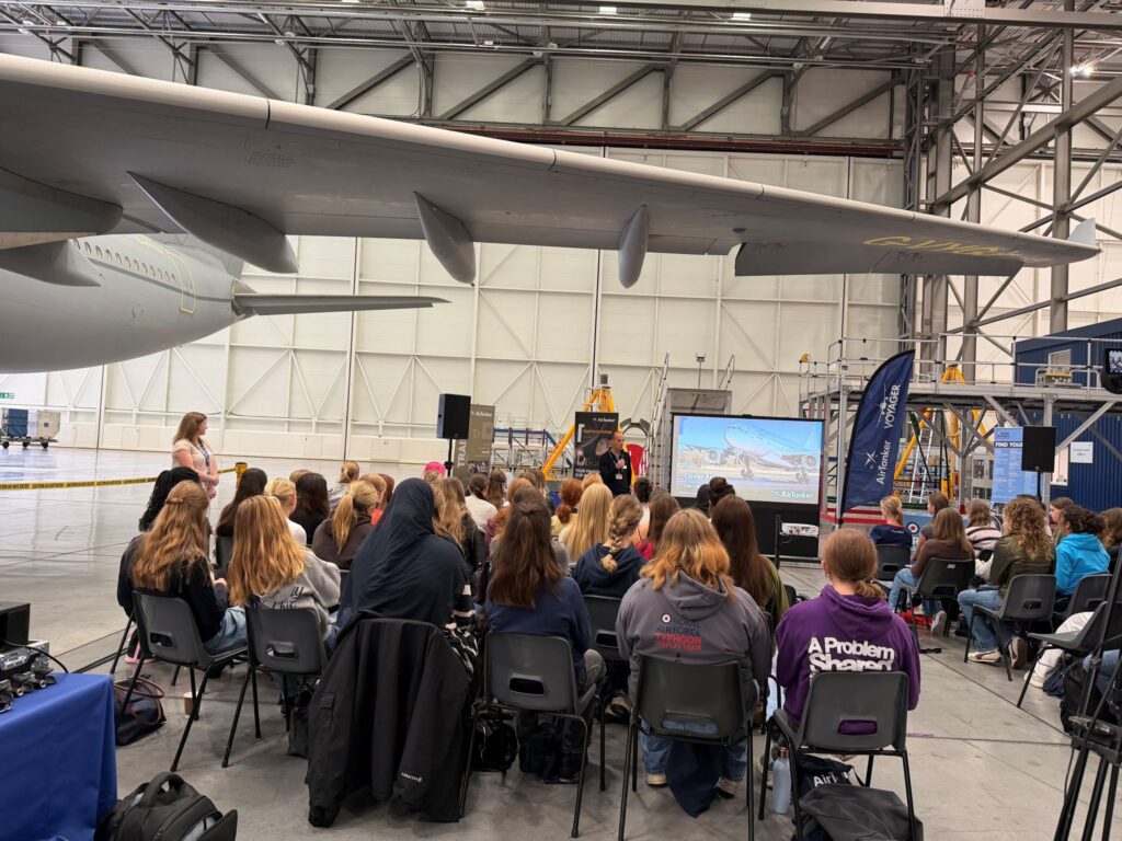 Attendees are listen to speakers at the Girls in Aviation Day.