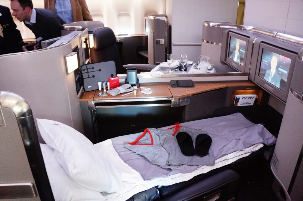 A old version of the first class seat on the 777-300ER in bed mode.