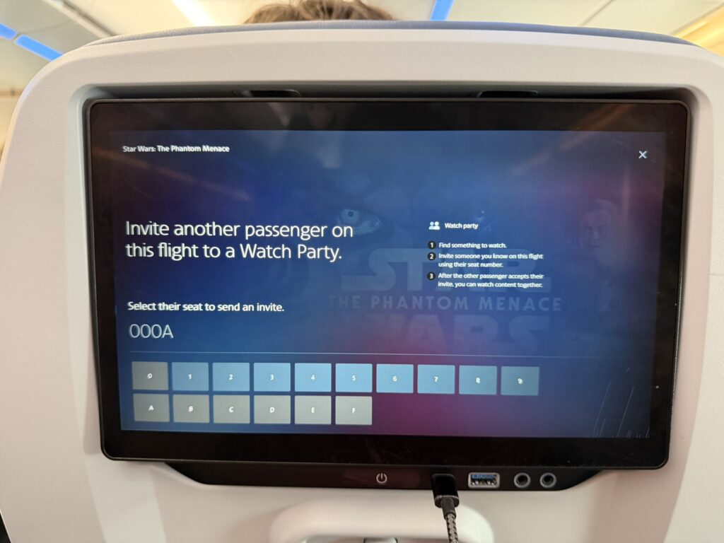 The screen beckons the passenger to "invite another person on this flight to a Watch Party"