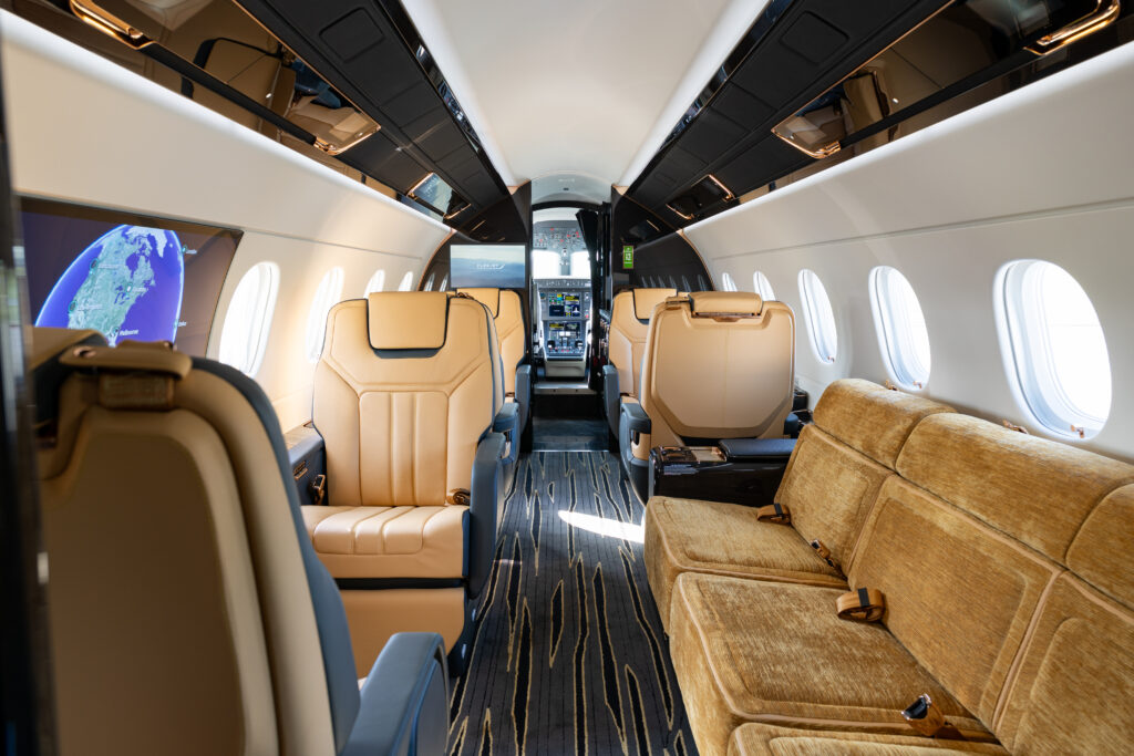 Flexjet Praetor 600E cabin interior with large OLED monitor