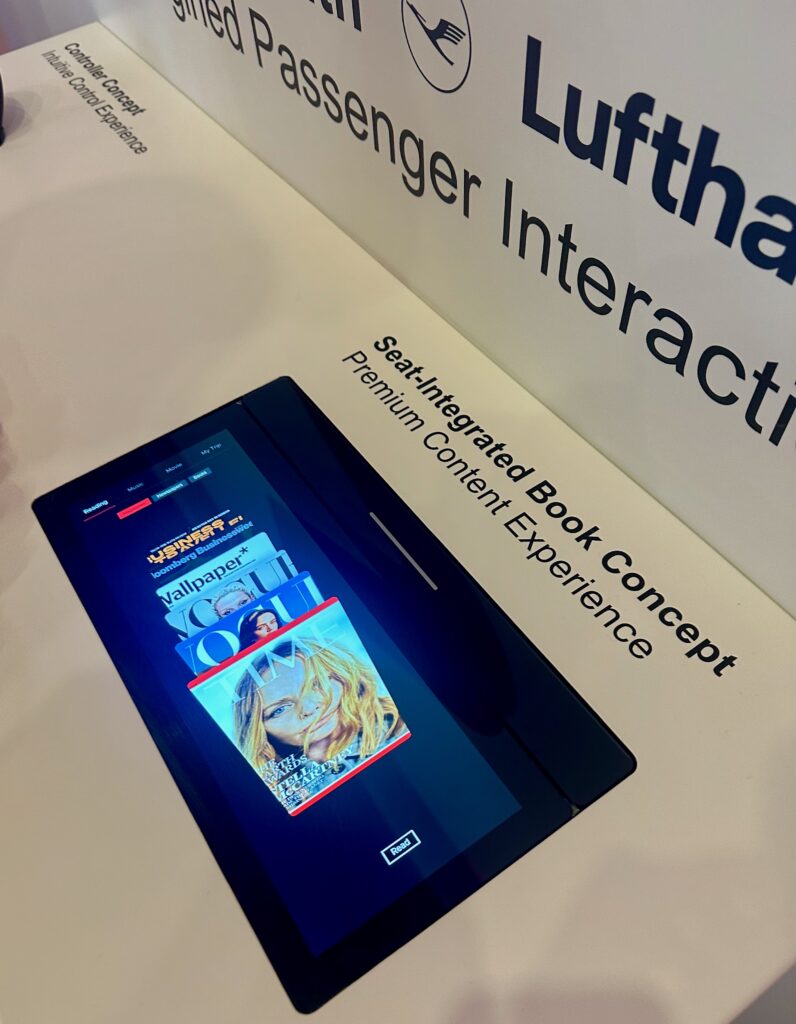 Seat -integrated book concept from Lufthansa Technik, as displayed on RAVE Aerospace's stand at AIX 2026.