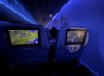 Seatback IFE and blue mood lighting on a JetBlue A220