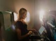 SAS passenger working on their laptop in flight, while using Starlink inflight Wi-Fi.