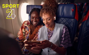 Two female passengers are watching Sport 24 in flight on their personal devices.