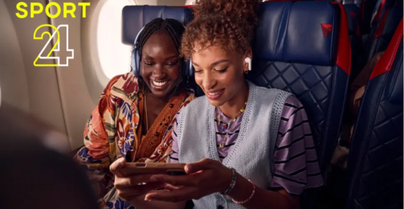 Two female passengers are watching Sport 24 in flight on their personal devices.