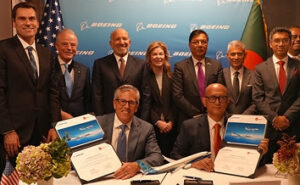 Execs from Boeing and Biman Bangladesh Airlines celebrate the airline's new order