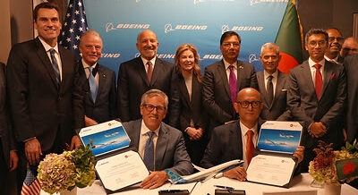 Execs from Boeing and Biman Bangladesh Airlines celebrate the airline's new order