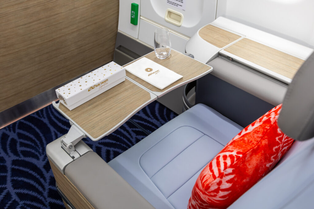 Air Tahiti Signature products sit on the business class seat's tray table