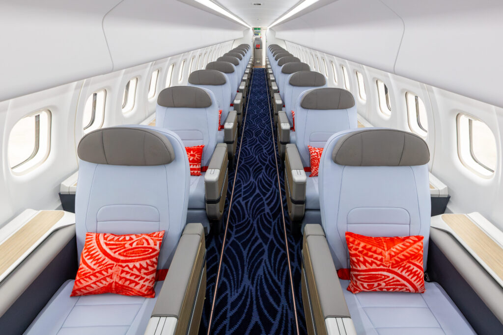 Air Tahiti ATR HighLine All-Business Class cabin with seats configured 1-1. A red and white decorative pillow sits on each seat.