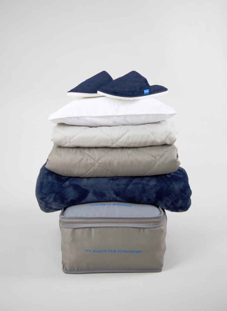 EL AL Israel Airlines bedding in a decorative pile.