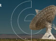 Gilat logo in the top left corner. The image shows a very large satellite dish in a large open space at night.