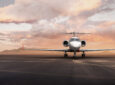 Gulfstream bizjet is parked; a spectacular sky is seen behind it. This is a hero shot of the jet.