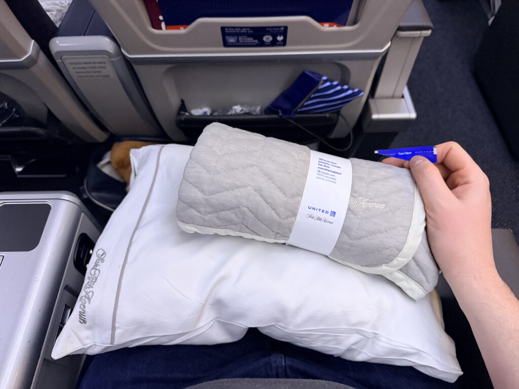 A pillow, blanket and amenity kit for United Airlines' Premium Plus passengers aboard the 787