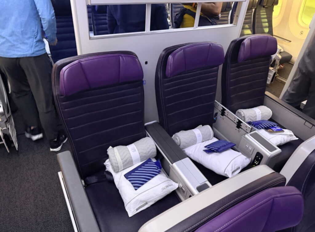 Purple seats with brighter purple headrests in United Premium Plus aboard the 787