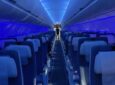 Inside an Air Astana A321LR. Blue LED lighting creates a calm scene in the cabin