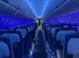 Inside an Air Astana A321LR. Blue LED lighting creates a calm scene in the cabin