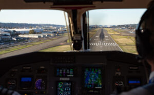 Looking out the cockpit windows of the SeaPort Pilatus PC-12 at the runway ahead