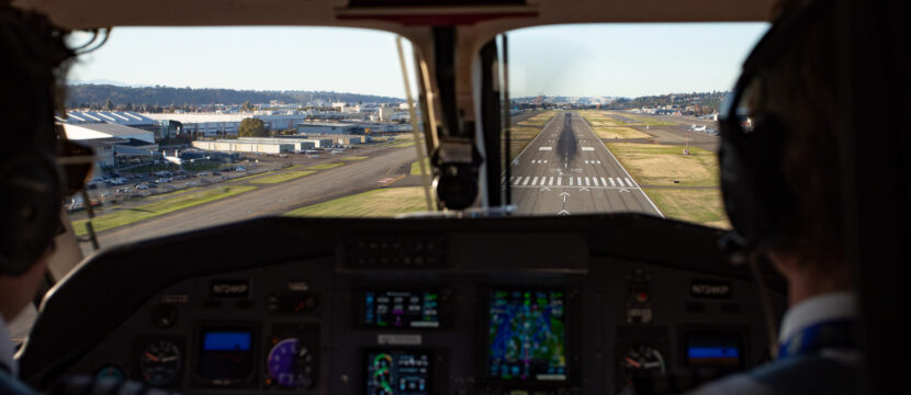 Looking out the cockpit windows of the SeaPort Pilatus PC-12 at the runway ahead