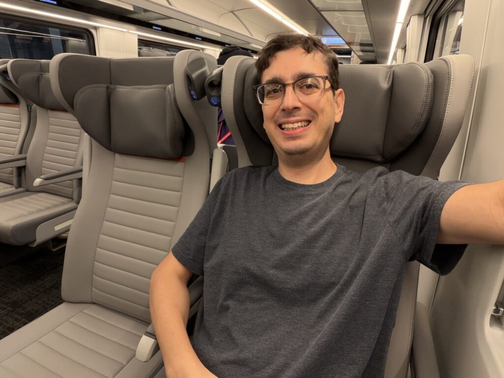 The author, Jason Rabinowitz, smiles for a selfie aboard the Airo trainset plying the Pacific Northwest Cascades route