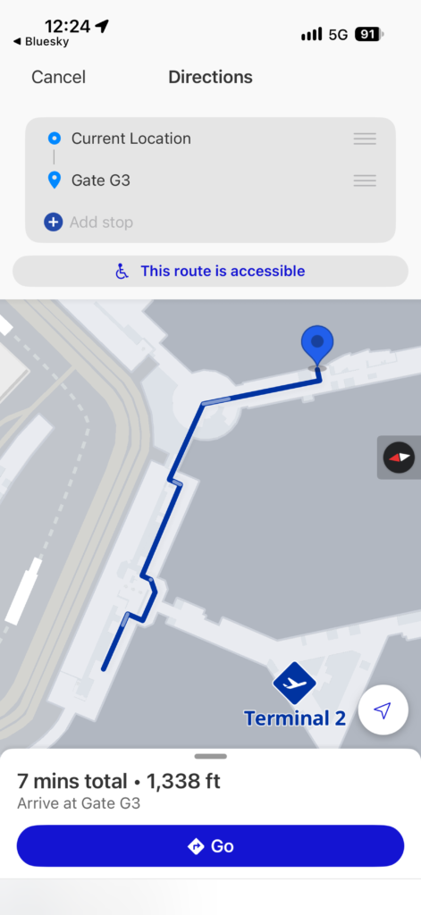 The United Airlines app is displaying the walking distance and route to the gate.