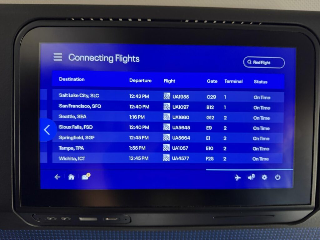 The United Airlines IFE screen is listing connecting flight info.