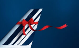 Air France aircraft tail with a red ribbon.